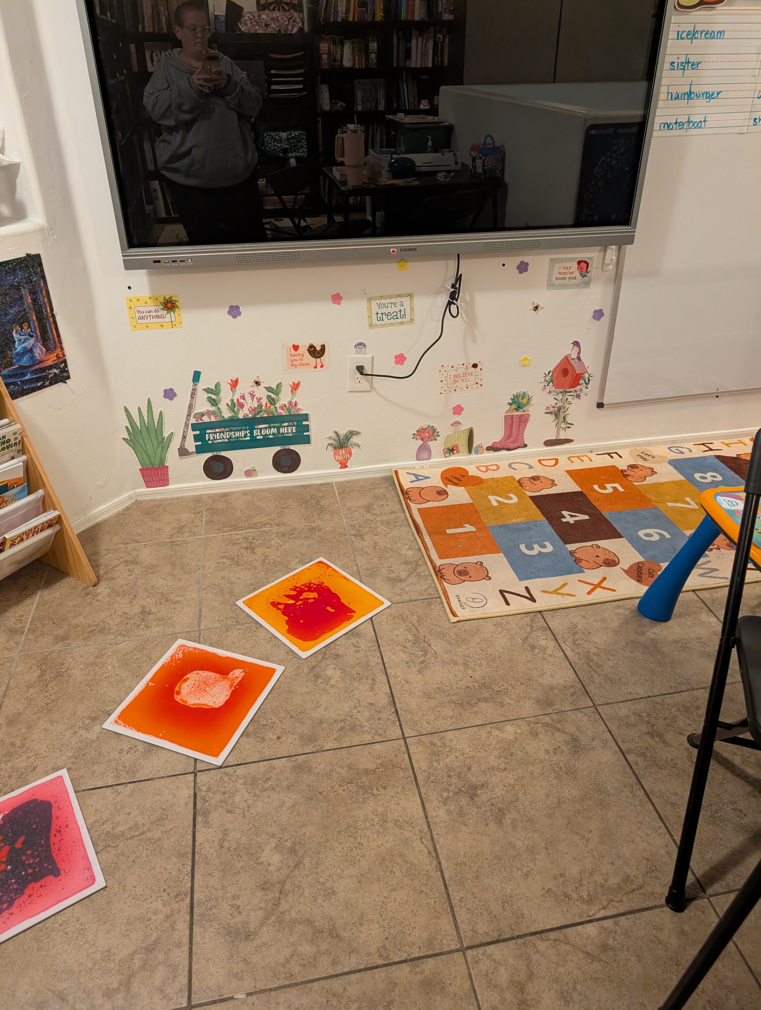 Colorful chemistry experiment squares laid out on the classroom floor