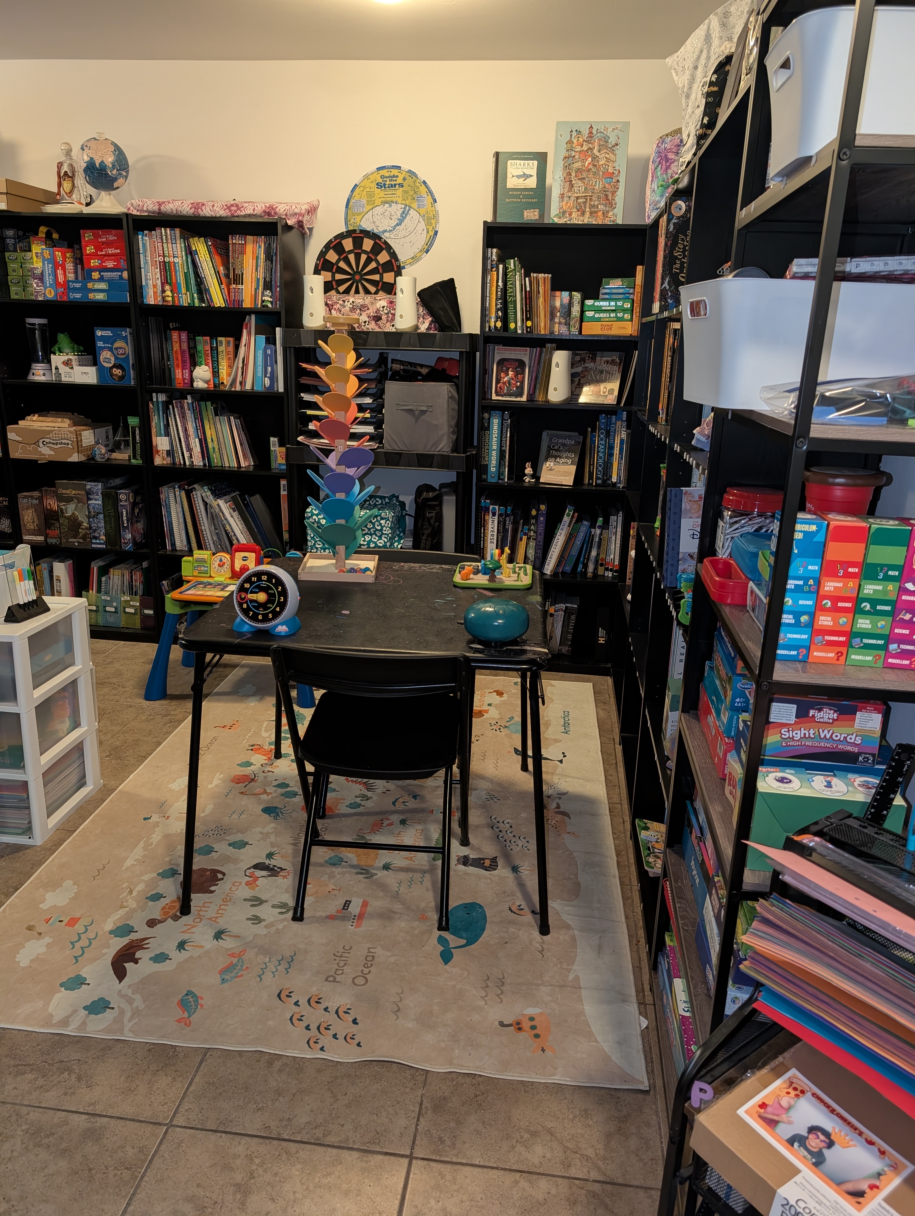 A "Welcome to Our Library" sign above shelves of books and board games